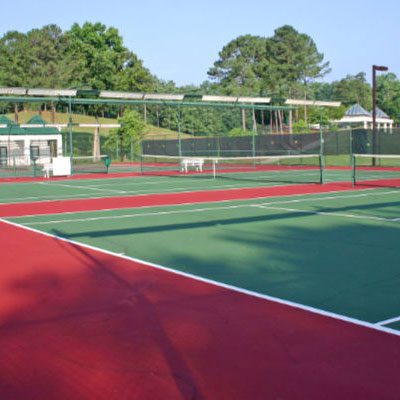 Tennis court line marking on a hard surface multi use games area