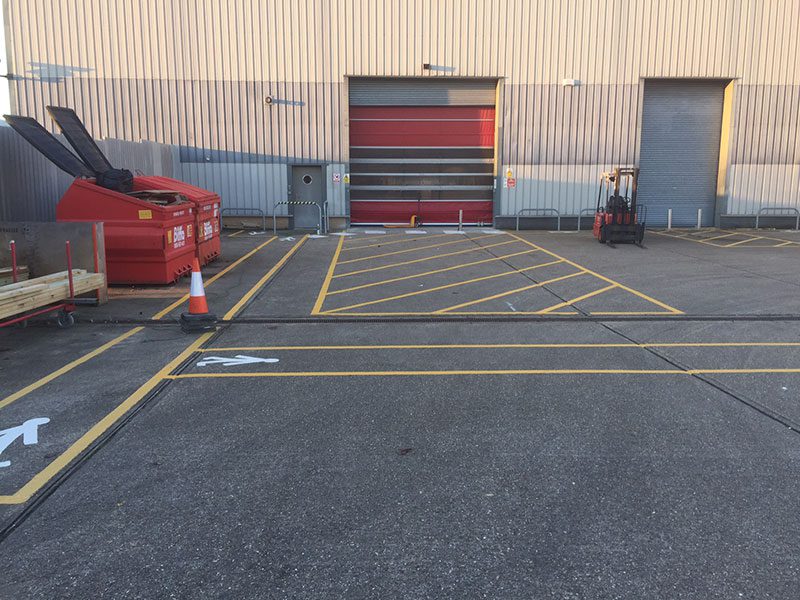 Warehouse floor marking defining walkways and storage zones in Reigate