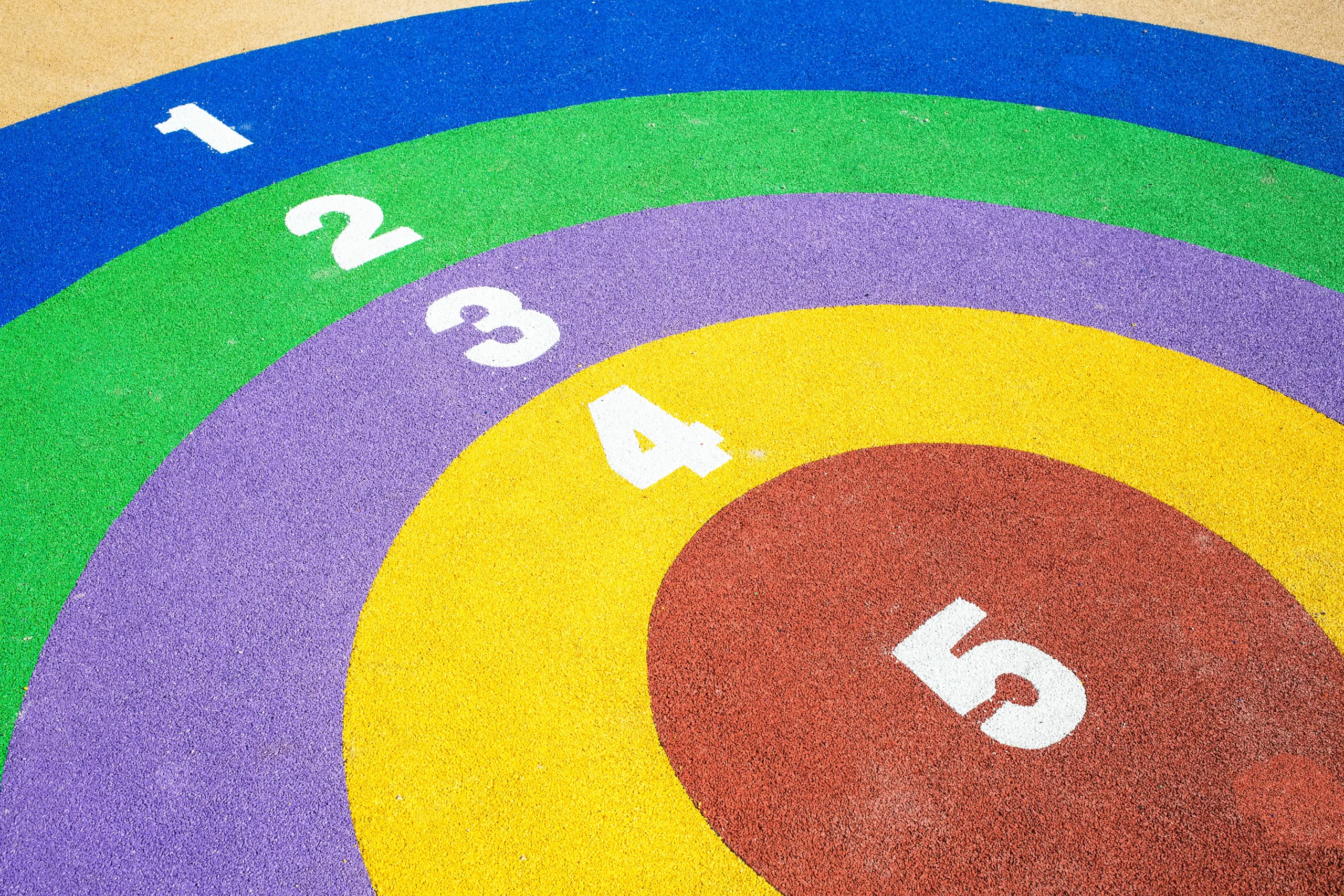 Aerial view of a colourful thermoplastic playground marking scheme
